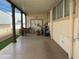 Covered patio with seating area, potted plants, and storage at 17200 W Bell Rd # 641, Surprise, AZ 85374