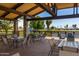 Spacious gazebo with tables and chairs overlooking a pond at 17200 W Bell Rd # 641, Surprise, AZ 85374