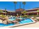 Relaxing community pool with fountain and rock landscaping at 17200 W Bell Rd # 641, Surprise, AZ 85374