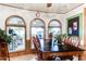 Bright dining area with wood table and chairs, overlooking the patio at 17200 W Bell Rd # 641, Surprise, AZ 85374
