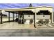 Tan manufactured home with covered carport and landscaped front yard at 17200 W Bell Rd # 641, Surprise, AZ 85374