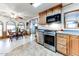 Kitchen with stainless steel appliances and wood cabinets at 17200 W Bell Rd # 641, Surprise, AZ 85374