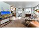 Living room with floral couch and view into the kitchen and dining area at 17200 W Bell Rd # 641, Surprise, AZ 85374
