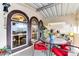 Covered patio with seating area and potted plants at 17200 W Bell Rd # 641, Surprise, AZ 85374