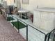 Small side yard with a table, storage unit and pet run at 17200 W Bell Rd # 641, Surprise, AZ 85374