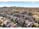 Aerial view of houses in a community near mountains at 17755 W Jojoba Rd, Goodyear, AZ 85338