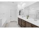 Modern bathroom with double vanity and a large mirror at 17755 W Jojoba Rd, Goodyear, AZ 85338