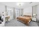 Bright bedroom with plush carpet and a large bed at 17755 W Jojoba Rd, Goodyear, AZ 85338