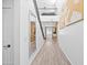 Bright entryway with wood-look floors and modern mirror at 17755 W Jojoba Rd, Goodyear, AZ 85338