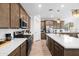 Spacious kitchen featuring wood cabinets and a large island at 17755 W Jojoba Rd, Goodyear, AZ 85338