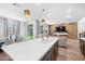 Modern kitchen with white quartz countertops and stainless steel appliances at 17755 W Jojoba Rd, Goodyear, AZ 85338