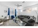 Spacious living room with sectional sofa and workspace at 17755 W Jojoba Rd, Goodyear, AZ 85338