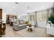Open living room and kitchen with grey sectional sofa at 17755 W Jojoba Rd, Goodyear, AZ 85338