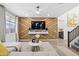 Living room with large TV and stylish gold accents at 17755 W Jojoba Rd, Goodyear, AZ 85338