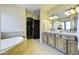 Elegant bathroom with double vanity and soaking tub at 1777 W Ocotillo Rd # 2, Chandler, AZ 85248