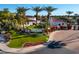 Gated community entrance with lush landscaping and Spanish-style architecture at 1777 W Ocotillo Rd # 2, Chandler, AZ 85248