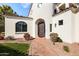 Elegant entryway with a curved walkway and dark brown door at 1777 W Ocotillo Rd # 2, Chandler, AZ 85248