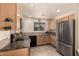 Modern kitchen with granite countertops and stainless steel appliances at 1880 E Desert Rose Trl, San Tan Valley, AZ 85143