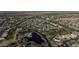 Aerial view of community, showing homes, lake and landscaping at 20948 N Sansom Dr, Maricopa, AZ 85138