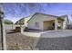 Backyard with covered patio, built-in grill, and paved area at 20948 N Sansom Dr, Maricopa, AZ 85138