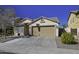 House exterior with two-car garage and landscaped yard at 20948 N Sansom Dr, Maricopa, AZ 85138