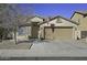 One-story house with a two-car garage and desert landscaping at 20948 N Sansom Dr, Maricopa, AZ 85138