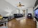 Living room with a comfortable seating area and tiled flooring at 20948 N Sansom Dr, Maricopa, AZ 85138