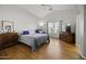Main bedroom with a double bed, ceiling fan, and dresser at 20948 N Sansom Dr, Maricopa, AZ 85138