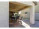 Covered patio with seating area and ceiling fan at 20948 N Sansom Dr, Maricopa, AZ 85138