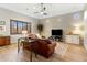 Spacious living room featuring a leather sofa and hardwood floors at 2179 E Cedar Pl, Chandler, AZ 85249