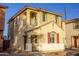 Two-story house with tan exterior, red shutters, and a balcony at 2208 N 78Th Gln, Phoenix, AZ 85035