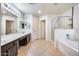 Bathroom with double sinks, shower, and bathtub at 225 N 236Th Ave, Buckeye, AZ 85396