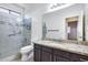 Bathroom with granite countertop, glass shower, and tile flooring at 225 N 236Th Ave, Buckeye, AZ 85396