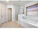 Bathroom with shower, bathtub, and linen closet at 225 N 236Th Ave, Buckeye, AZ 85396