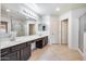 Bathroom with double sinks, large mirror, and separate shower at 225 N 236Th Ave, Buckeye, AZ 85396