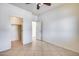 Bedroom with tile floors, ceiling fan and closet at 225 N 236Th Ave, Buckeye, AZ 85396