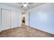 Bedroom with double door closet and adjacent bathroom at 225 N 236Th Ave, Buckeye, AZ 85396