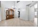 Bright dining room with tile floors and a large hutch at 225 N 236Th Ave, Buckeye, AZ 85396