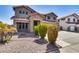 Landscaped front yard with mature shrubs and gravel at 225 N 236Th Ave, Buckeye, AZ 85396