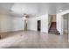 Gathering room with tile floors and stairway to second floor at 225 N 236Th Ave, Buckeye, AZ 85396