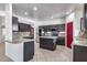 Kitchen boasts granite countertops and dark wood cabinets at 225 N 236Th Ave, Buckeye, AZ 85396