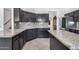 Modern kitchen with granite counters and dark wood cabinets at 225 N 236Th Ave, Buckeye, AZ 85396