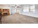 Bright home office featuring built-in desk and access to hallway at 225 N 236Th Ave, Buckeye, AZ 85396