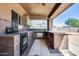 Outdoor kitchen area with built-in grill and countertop at 225 N 236Th Ave, Buckeye, AZ 85396