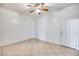 Simple spare bedroom with tile floors and an exterior door at 225 N 236Th Ave, Buckeye, AZ 85396