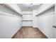 Spacious walk-in closet with ample shelving at 225 N 236Th Ave, Buckeye, AZ 85396