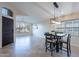 Bright dining area with a table and four chairs, and large windows at 2319 E Williams Dr, Phoenix, AZ 85024