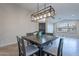 Dining room with modern light fixture and view of entryway at 2319 E Williams Dr, Phoenix, AZ 85024