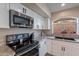 Kitchen with stainless steel stove and microwave at 2319 E Williams Dr, Phoenix, AZ 85024