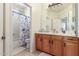 Bathroom with double sink vanity and shower/tub combo at 2614 W Florimond Rd, Phoenix, AZ 85086